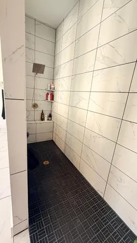 a living room with a table and a fireplace