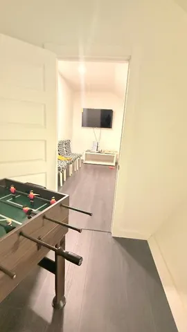 a large room with a large mirror and furniture