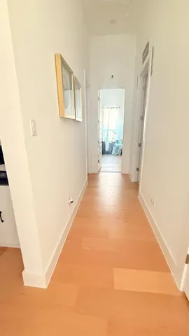 a view of a hallway with windows