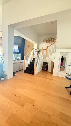 a view of living room with furniture and a flat screen tv