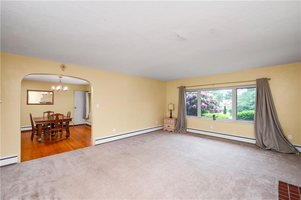 120 West Sunbury Road Butler, PA 16001 - Photo 14 of 46 an empty room with furniture and a floor to ceiling window