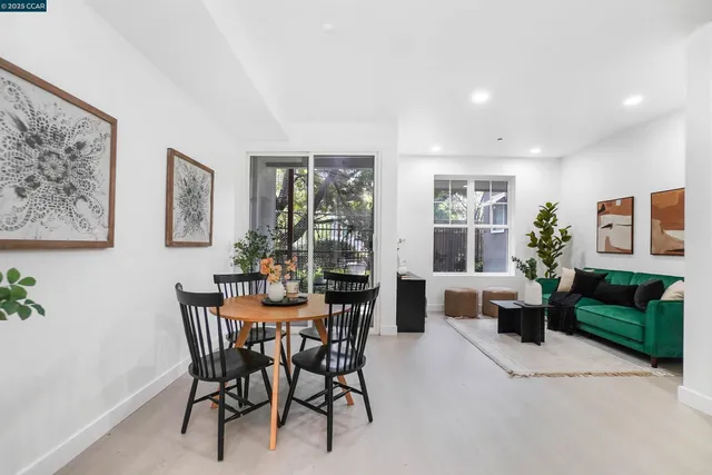a view of a dining room with furniture and window