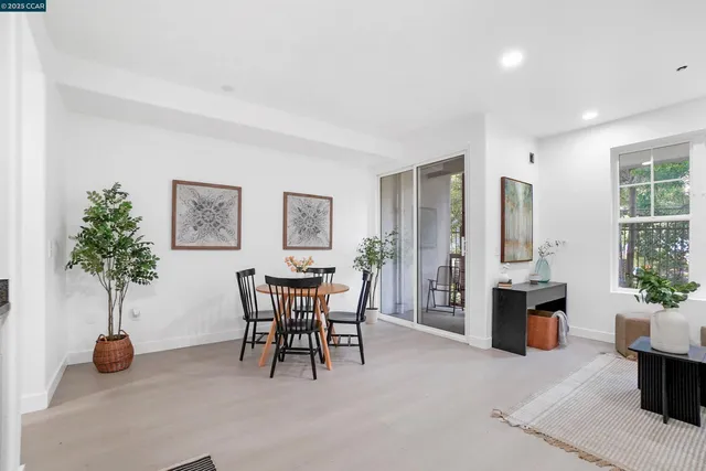 a balcony with chairs and table