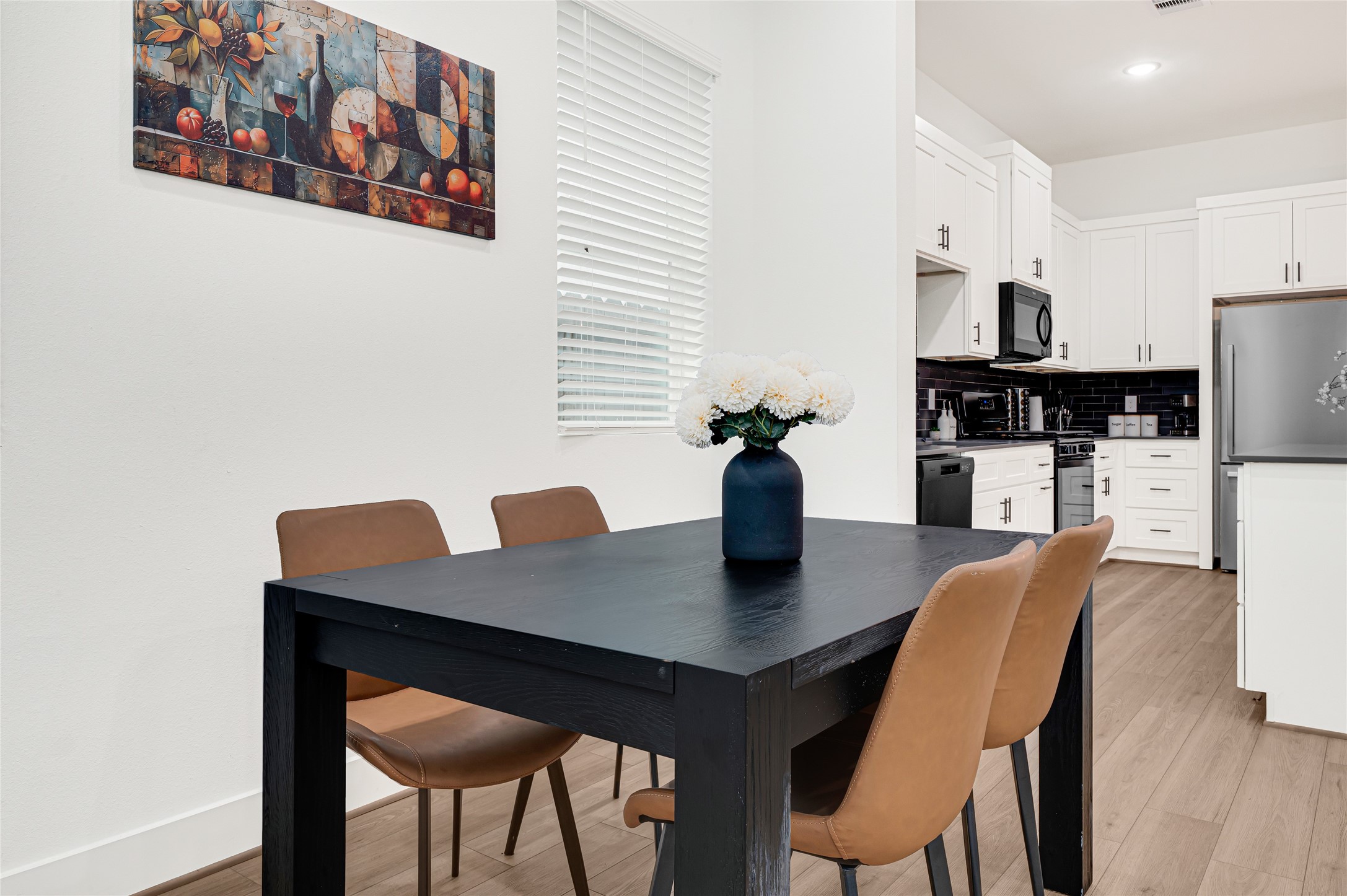 4201 Stassen Street Houston, TX 77051 - Photo 17 of 39 a view of a dining room with furniture and wooden floor