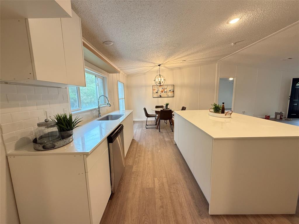 2002 County Road 906 Princeton, TX 75407 - Photo 12 of 31 a kitchen with sink a counter top space and appliances