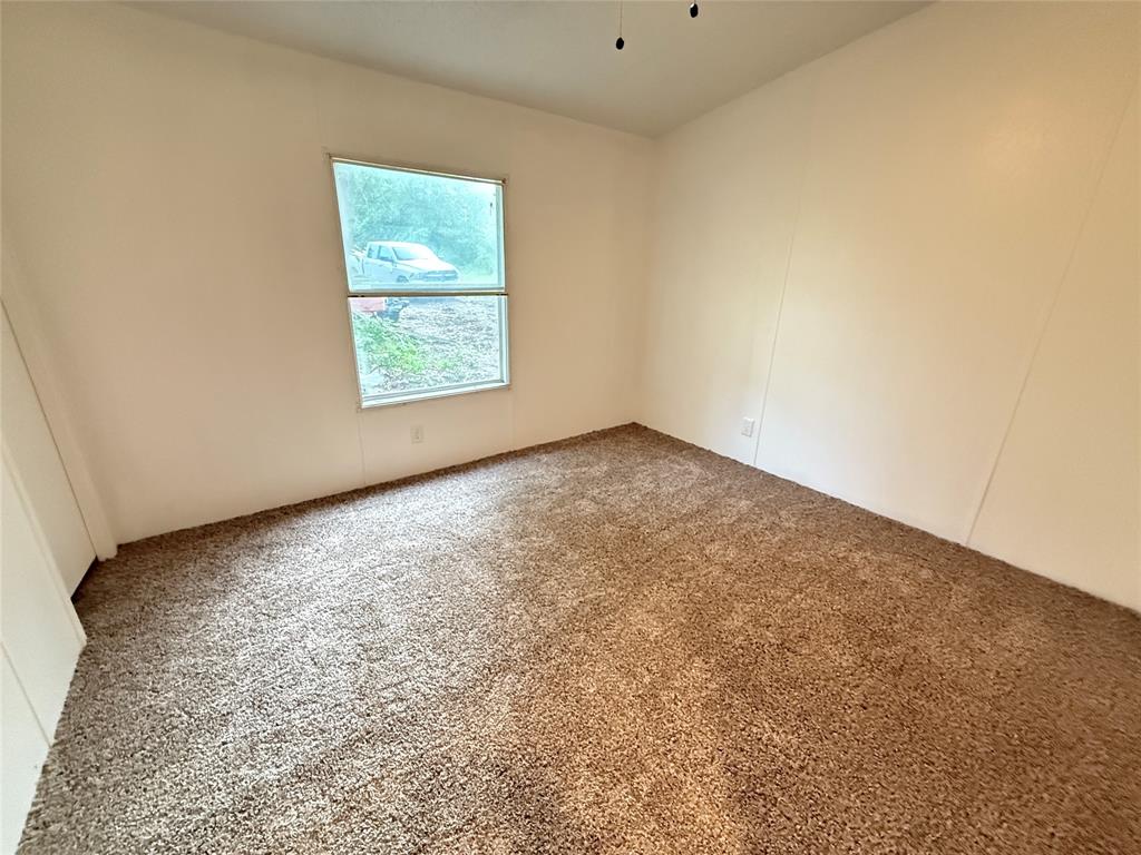 2002 County Road 906 Princeton, TX 75407 - Photo 22 of 31 an empty room with a window