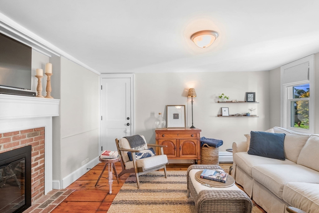 20 Summer Street, Unit 20 Ipswich, MA 01938 - Photo 18 of 42 a living room with furniture and a fireplace