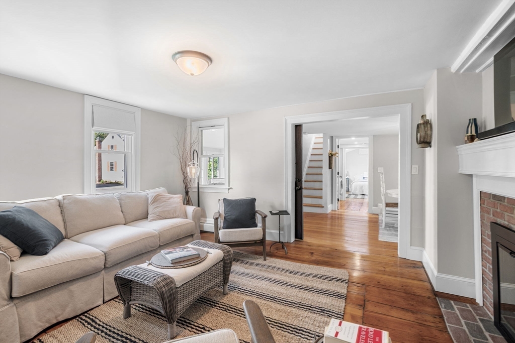 20 Summer Street, Unit 20 Ipswich, MA 01938 - Photo 20 of 42 a living room with furniture and a fireplace