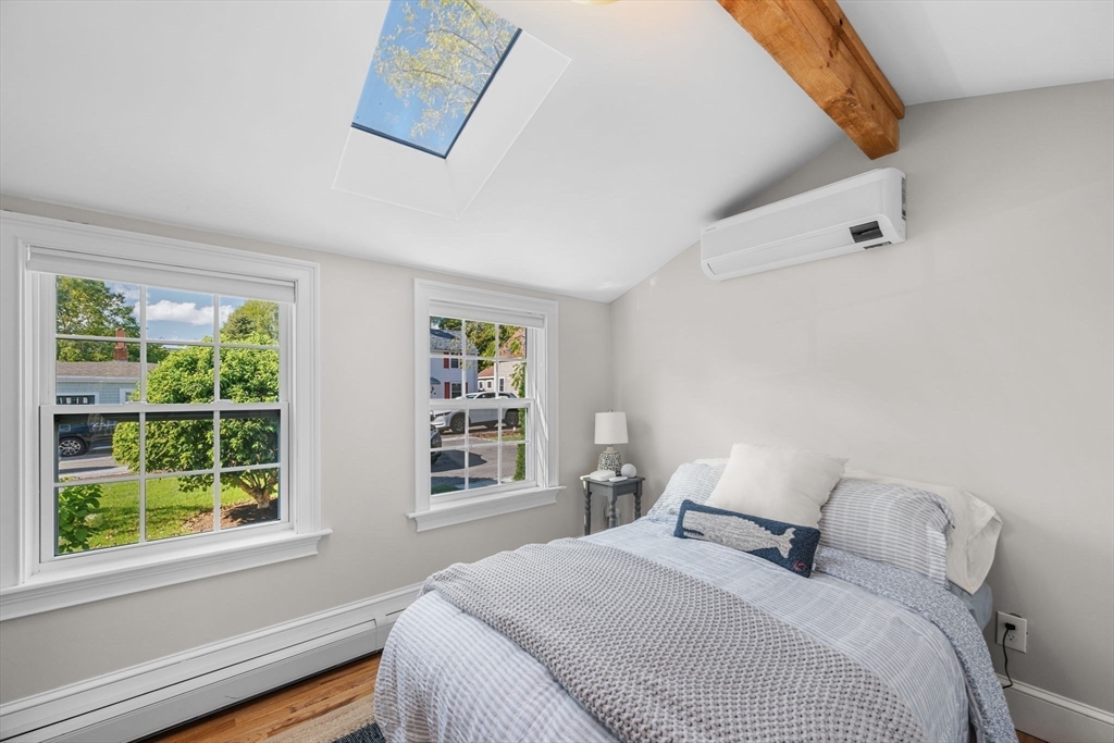 20 Summer Street, Unit 20 Ipswich, MA 01938 - Photo 26 of 42 a bedroom with a bed and a window