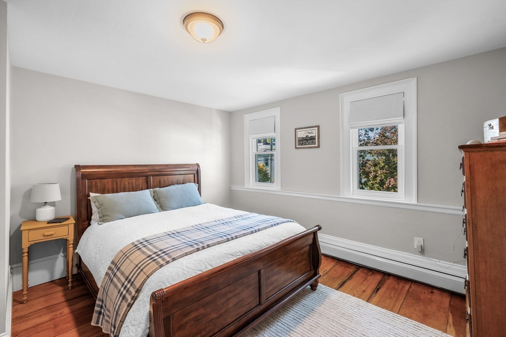 20 Summer Street, Unit 20 Ipswich, MA 01938 - Photo 29 of 42 a bedroom with a bed and a window