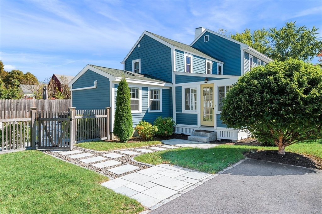 20 Summer Street, Unit 20 Ipswich, MA 01938 - Photo 3 of 42 a front view of a house with a yard and green space