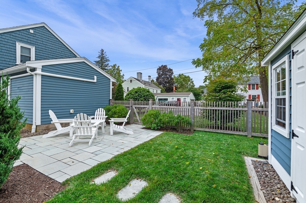 20 Summer Street, Unit 20 Ipswich, MA 01938 - Photo 34 of 42 a view of a chair and table in backyard of the house