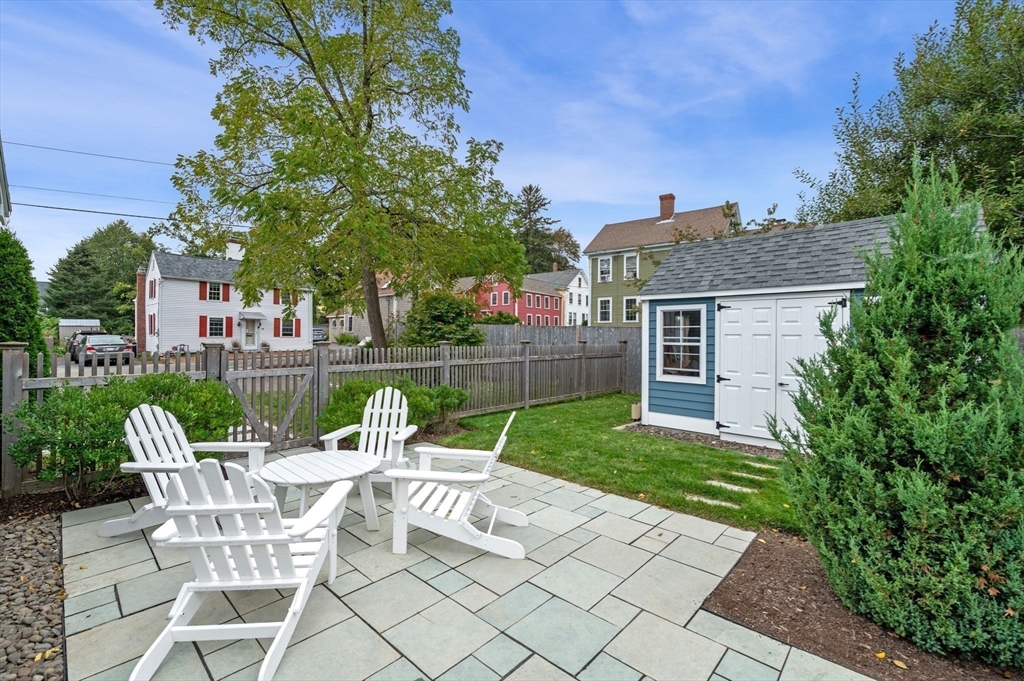 20 Summer Street, Unit 20 Ipswich, MA 01938 - Photo 35 of 42 a view of house with backyard sitting area and garden