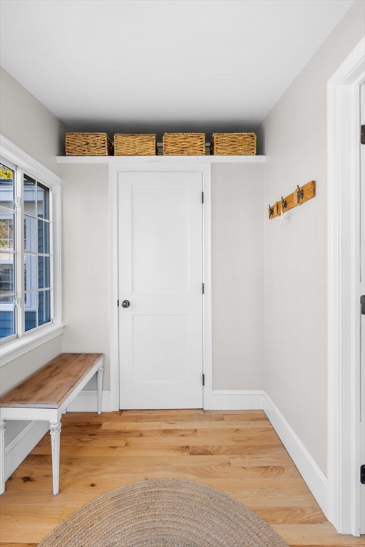 20 Summer Street, Unit 20 Ipswich, MA 01938 - Photo 7 of 42 a view of a livingroom with wooden floor and a refrigerator
