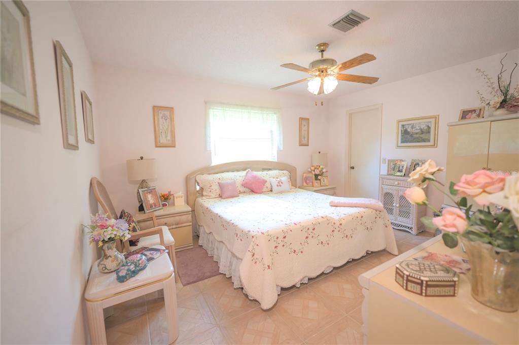 615 Toledo Road North Port, FL 34287 - Photo 11 of 16 a bedroom with a bed and a window