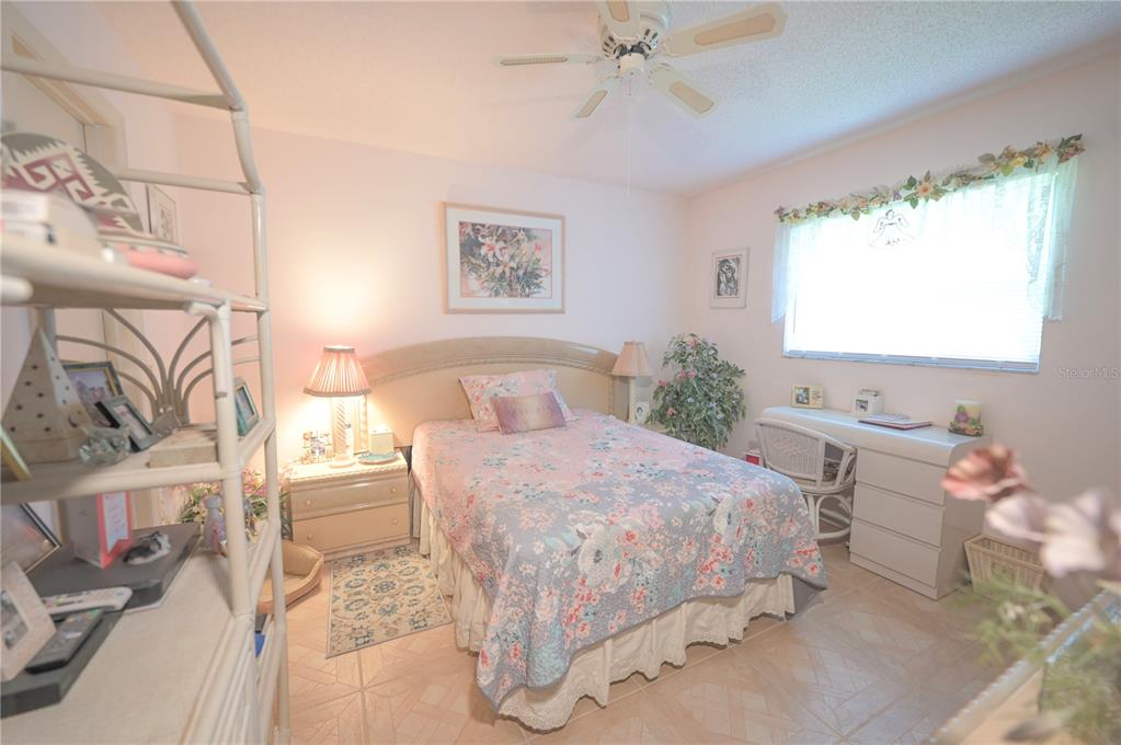 615 Toledo Road North Port, FL 34287 - Photo 13 of 16 a bedroom with a bed and a window
