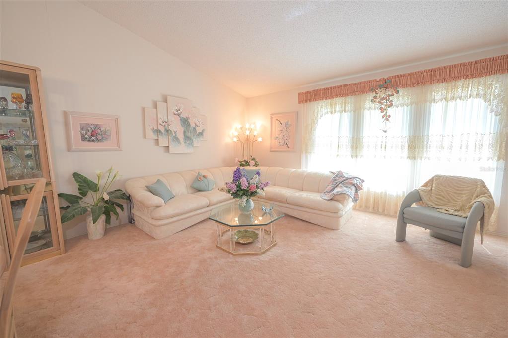 615 Toledo Road North Port, FL 34287 - Photo 4 of 16 a living room with furniture and a large window