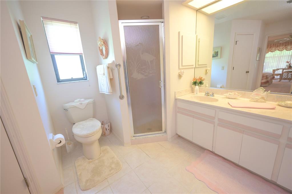 615 Toledo Road North Port, FL 34287 - Photo 9 of 16 a bathroom with a granite countertop sink toilet and shower