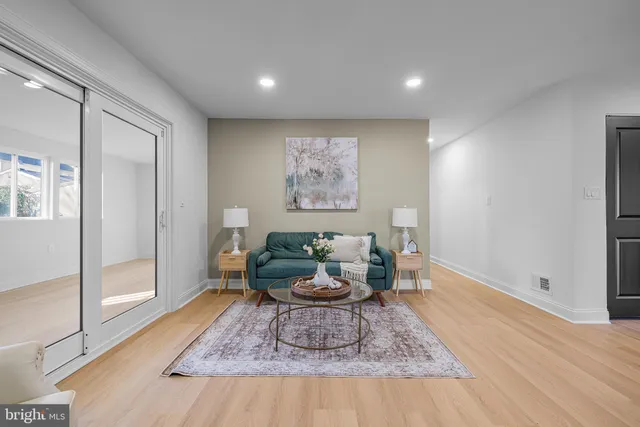 a living room with furniture and a rug