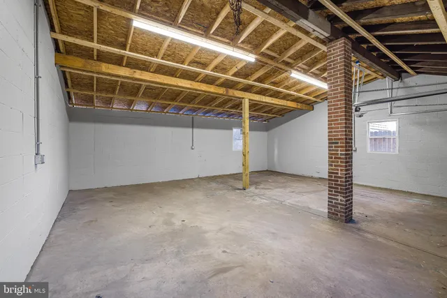 a view of a room with wooden walls