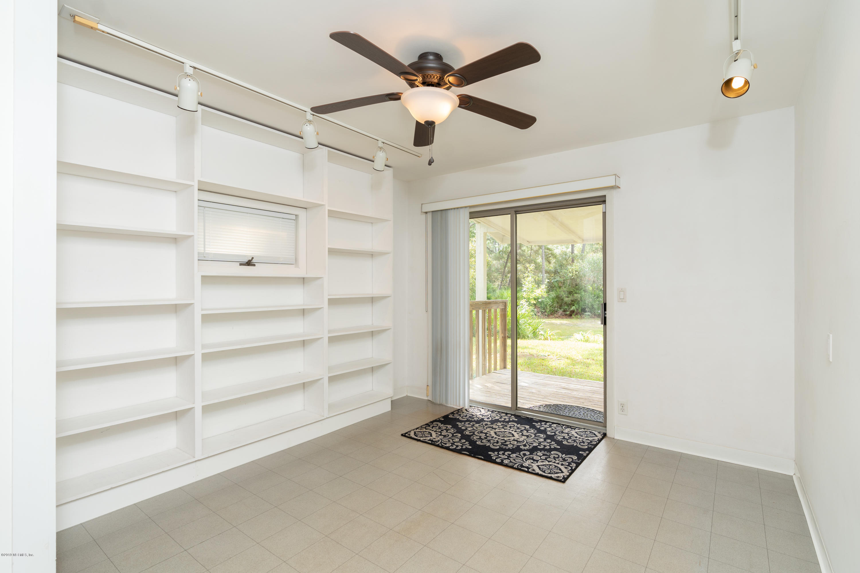 1090 Cherry Tree Road St. Augustine, FL 32086 - Photo 17 of 33 a view of an empty room with a window