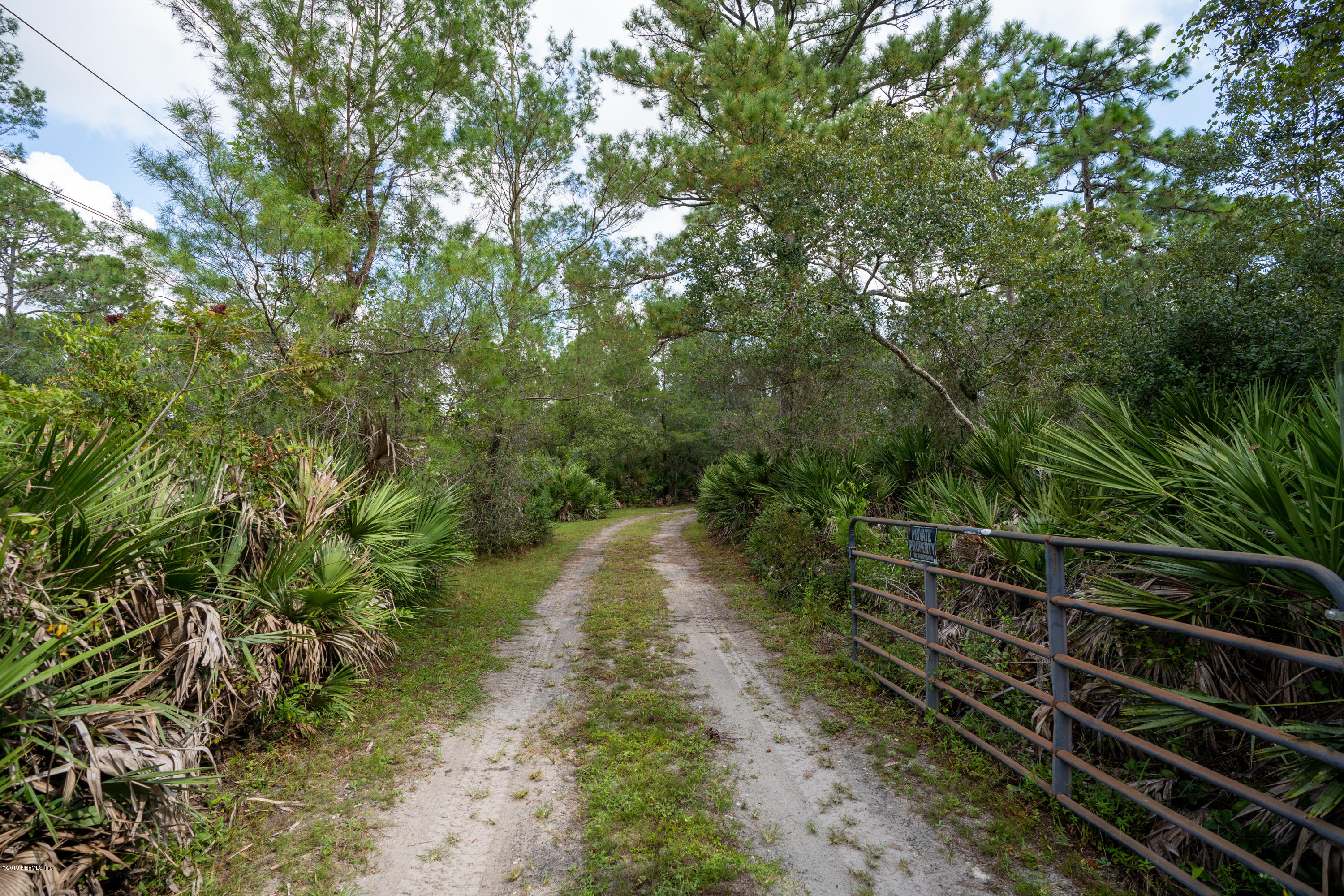 1090 Cherry Tree Road St. Augustine, FL 32086 - Photo 2 of 33 a pathway of a yard