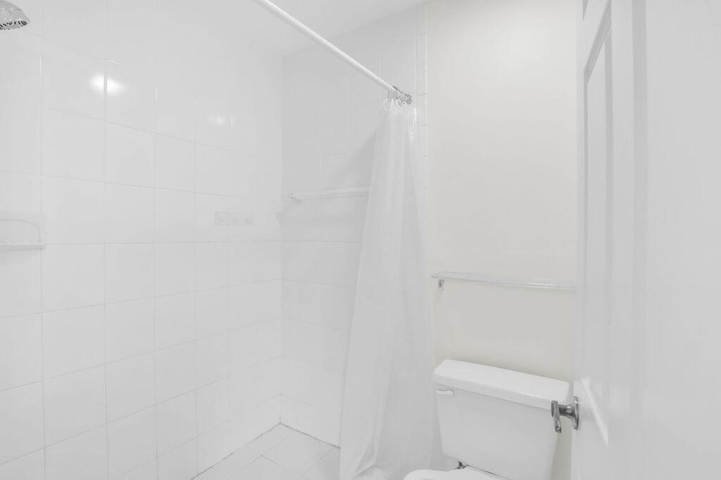 3300 Jaywood Terrace, Unit 2160 Boca Raton, FL 33431 - Photo 14 of 28 a white toilet sitting next to a white wall