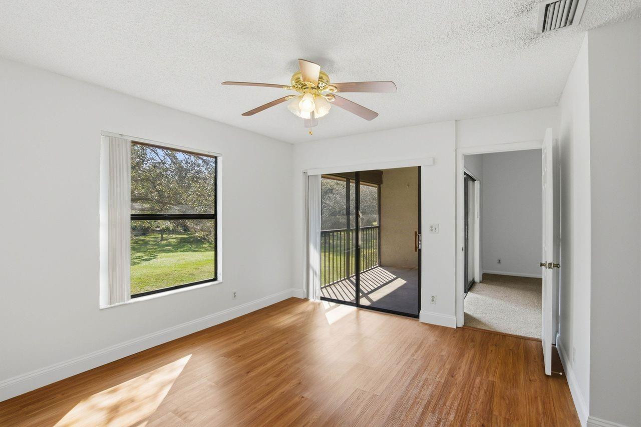 3300 Jaywood Terrace, Unit 2160 Boca Raton, FL 33431 - Photo 15 of 28 a view of an empty room with window and wooden floor