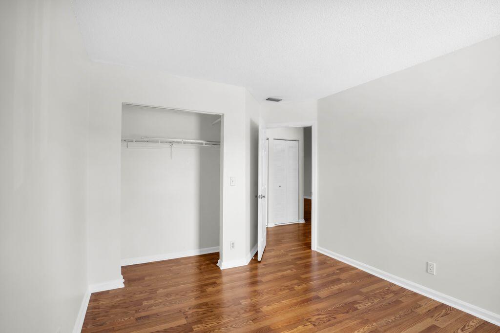 3300 Jaywood Terrace, Unit 2160 Boca Raton, FL 33431 - Photo 23 of 28 a view of an empty room with wooden floor