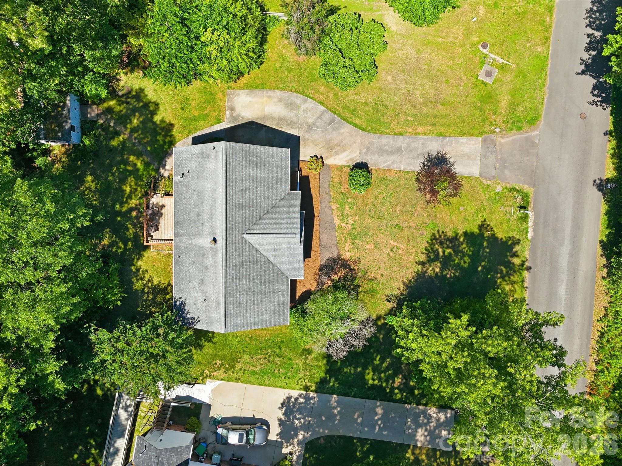 913 Pleasant Ridge Road Fort Mill, SC 29715 - Photo 31 of 40 an aerial view of a house with a yard and large trees