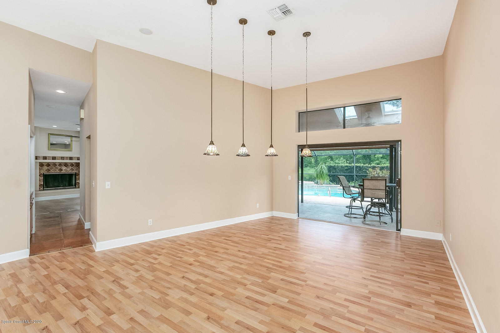 3805 Shady Run Road Melbourne, FL 32934 - Photo 12 of 42 a view of empty room with wooden floor and fan