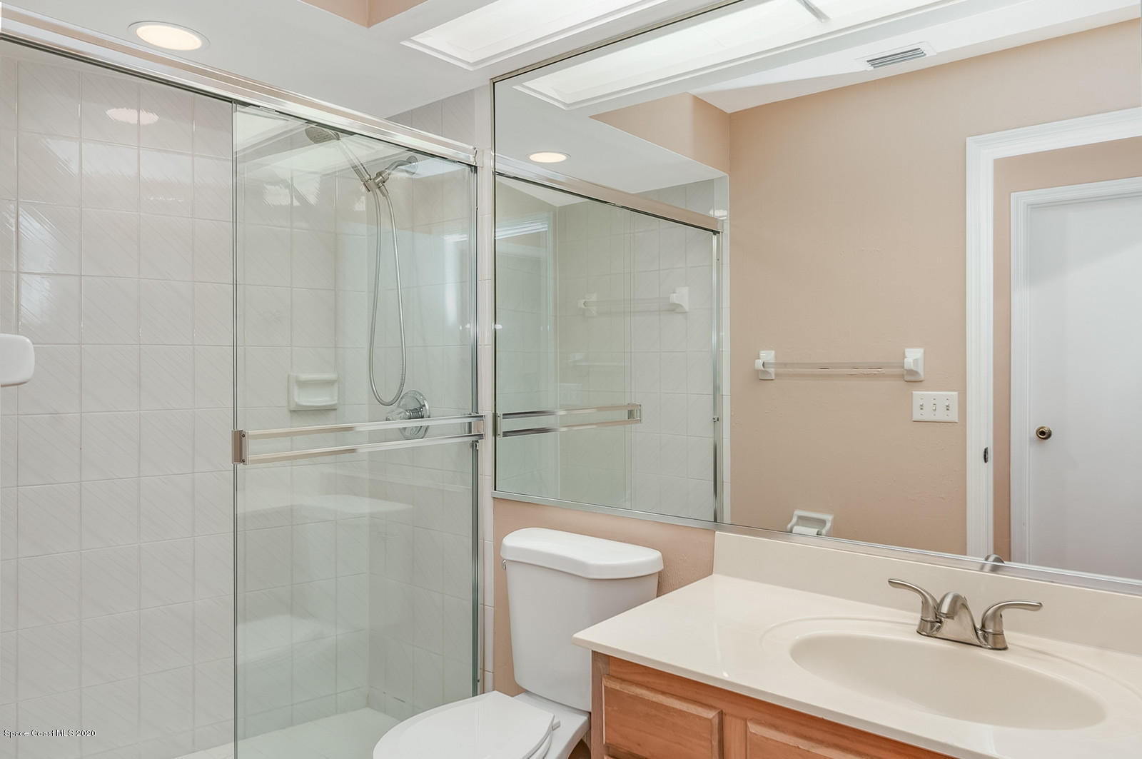 3805 Shady Run Road Melbourne, FL 32934 - Photo 21 of 42 a bathroom with a sink toilet and shower