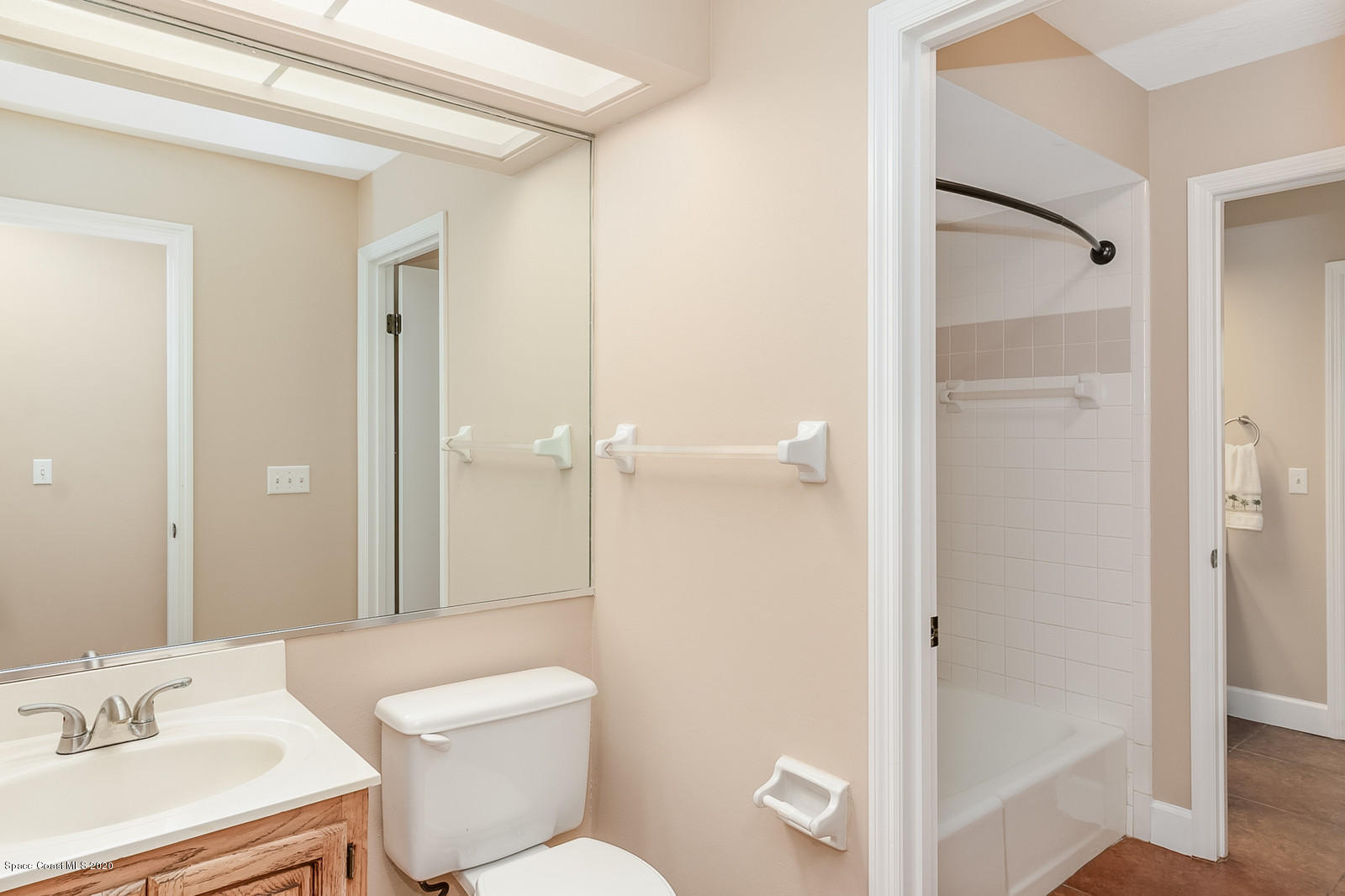 3805 Shady Run Road Melbourne, FL 32934 - Photo 25 of 42 a bathroom with a toilet sink and shower