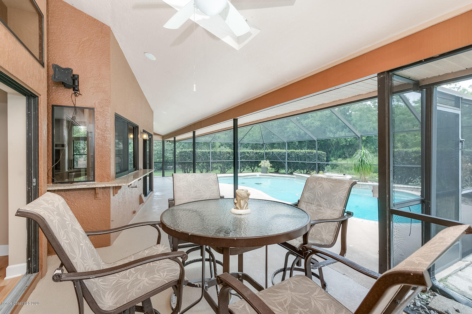 3805 Shady Run Road Melbourne, FL 32934 - Photo 31 of 42 a dining room with furniture and wooden floor