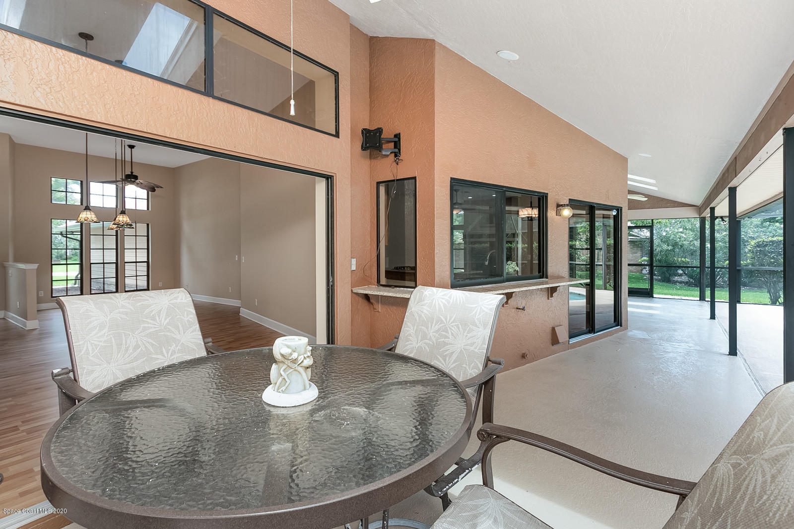 3805 Shady Run Road Melbourne, FL 32934 - Photo 32 of 42 a living room with furniture and a table