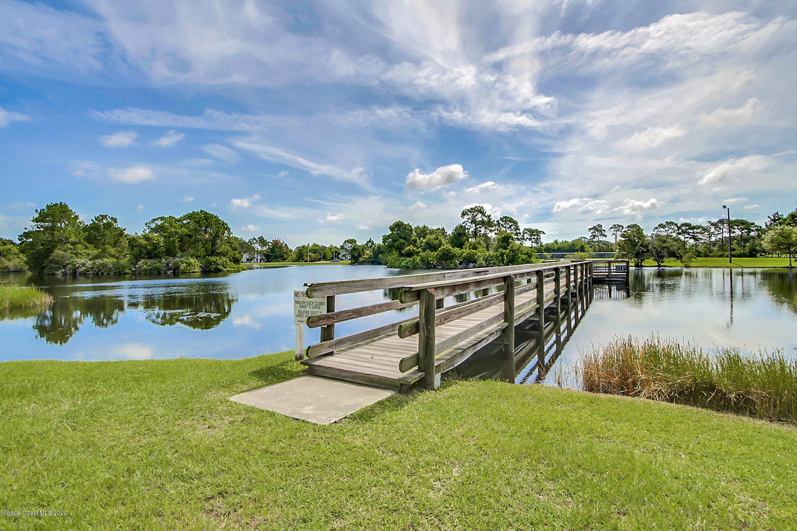 3805 Shady Run Road Melbourne, FL 32934 - Photo 36 of 42 a view of a lake with houses in the back