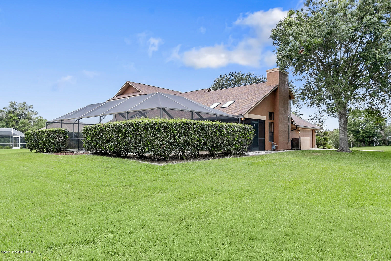 3805 Shady Run Road Melbourne, FL 32934 - Photo 5 of 42 a front view of a house with a garden