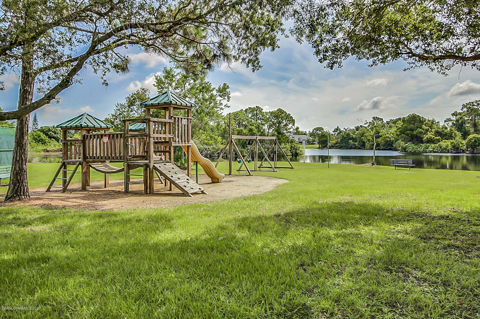 3805 Shady Run Road Melbourne, FL 32934 - Photo 41 of 42 a view of an house with swimming pool and an outdoor space