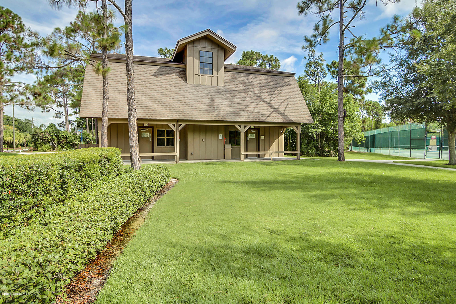 3805 Shady Run Road Melbourne, FL 32934 - Photo 42 of 42 a front view of a house with a yard