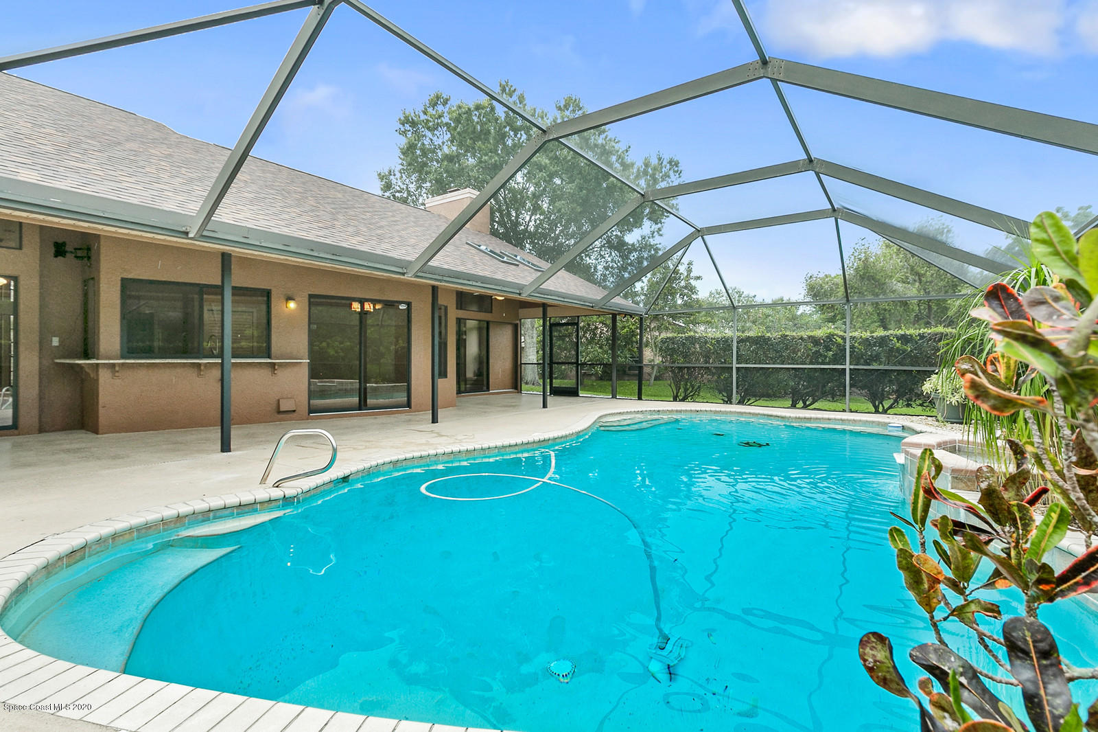 3805 Shady Run Road Melbourne, FL 32934 - Photo 9 of 42 a view of a backyard with a swimming pool