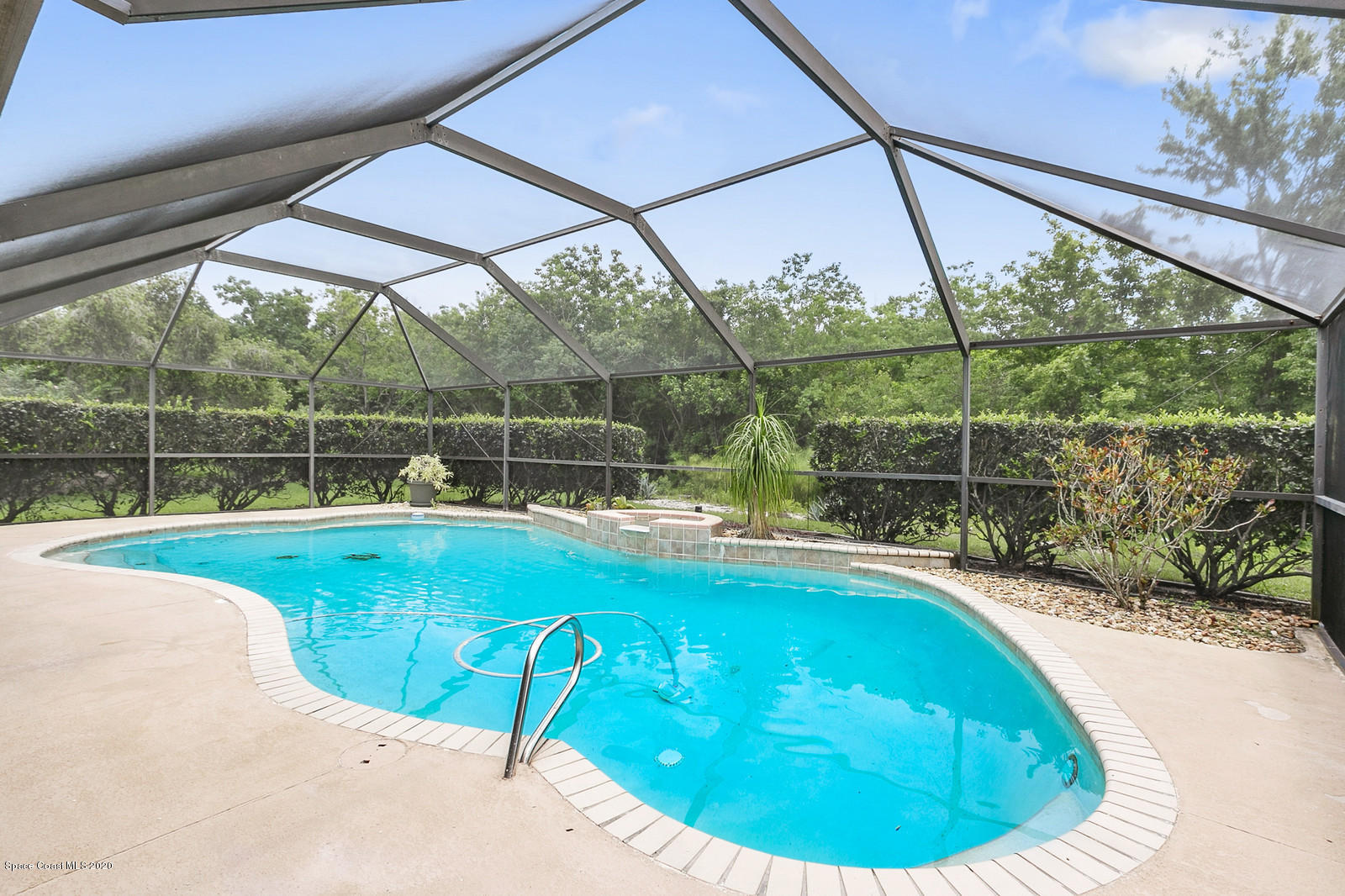 3805 Shady Run Road Melbourne, FL 32934 - Photo 10 of 42 a view of a swimming pool with a porch
