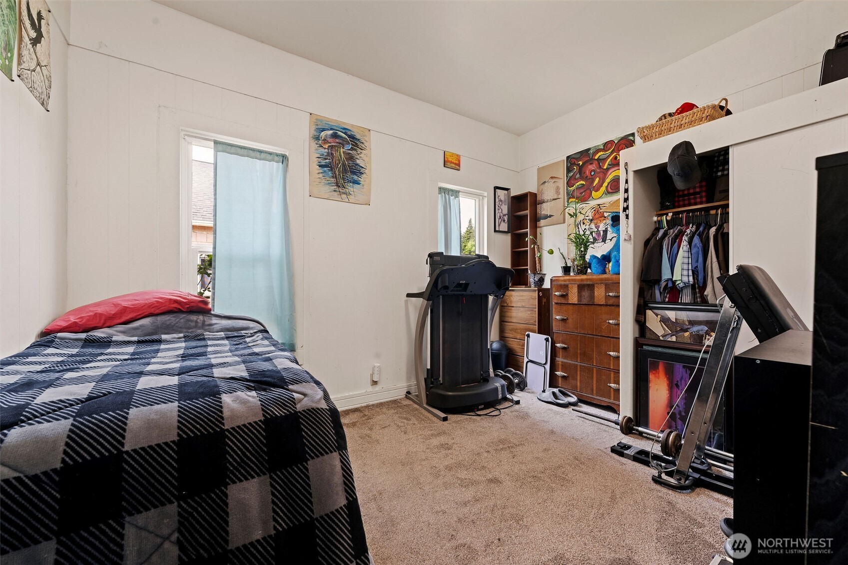 1218 Cedar Street Raymond, WA 98577 - Photo 14 of 31 a bedroom with a bed a standing and closet