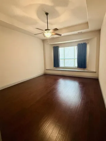 a spacious bathroom with a double vanity sink and a mirror
