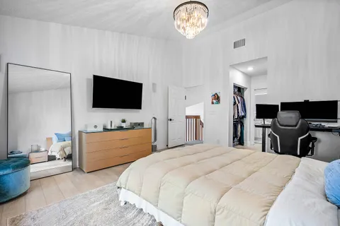 a front view of a house with a garden and yard