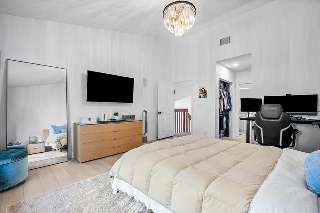 a front view of a house with a garden and yard