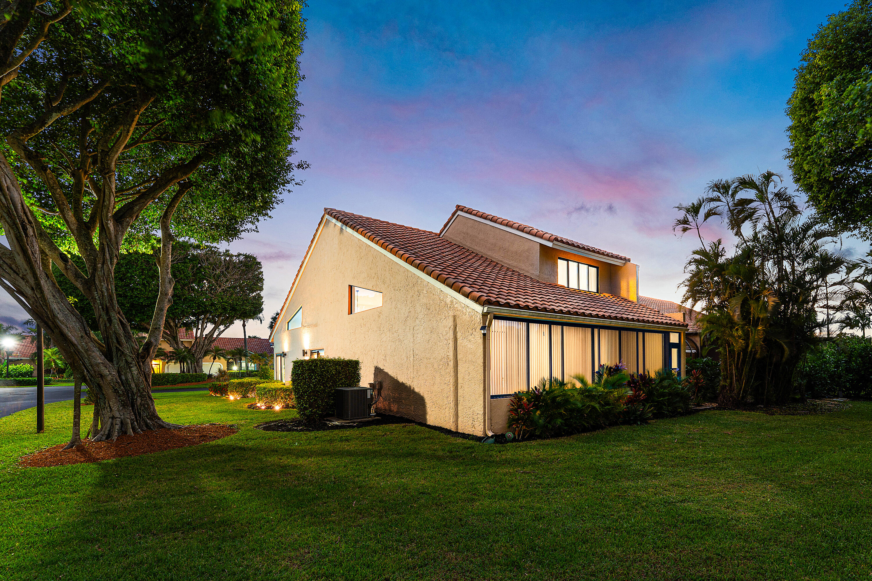 22627 Meridiana Drive Boca Raton, FL 33433 - Photo 39 of 58 a front view of a house with garden