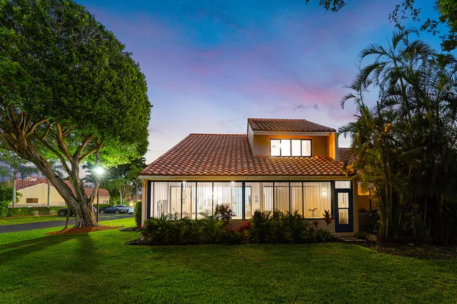 an aerial view of a house with yard swimming pool and outdoor seating