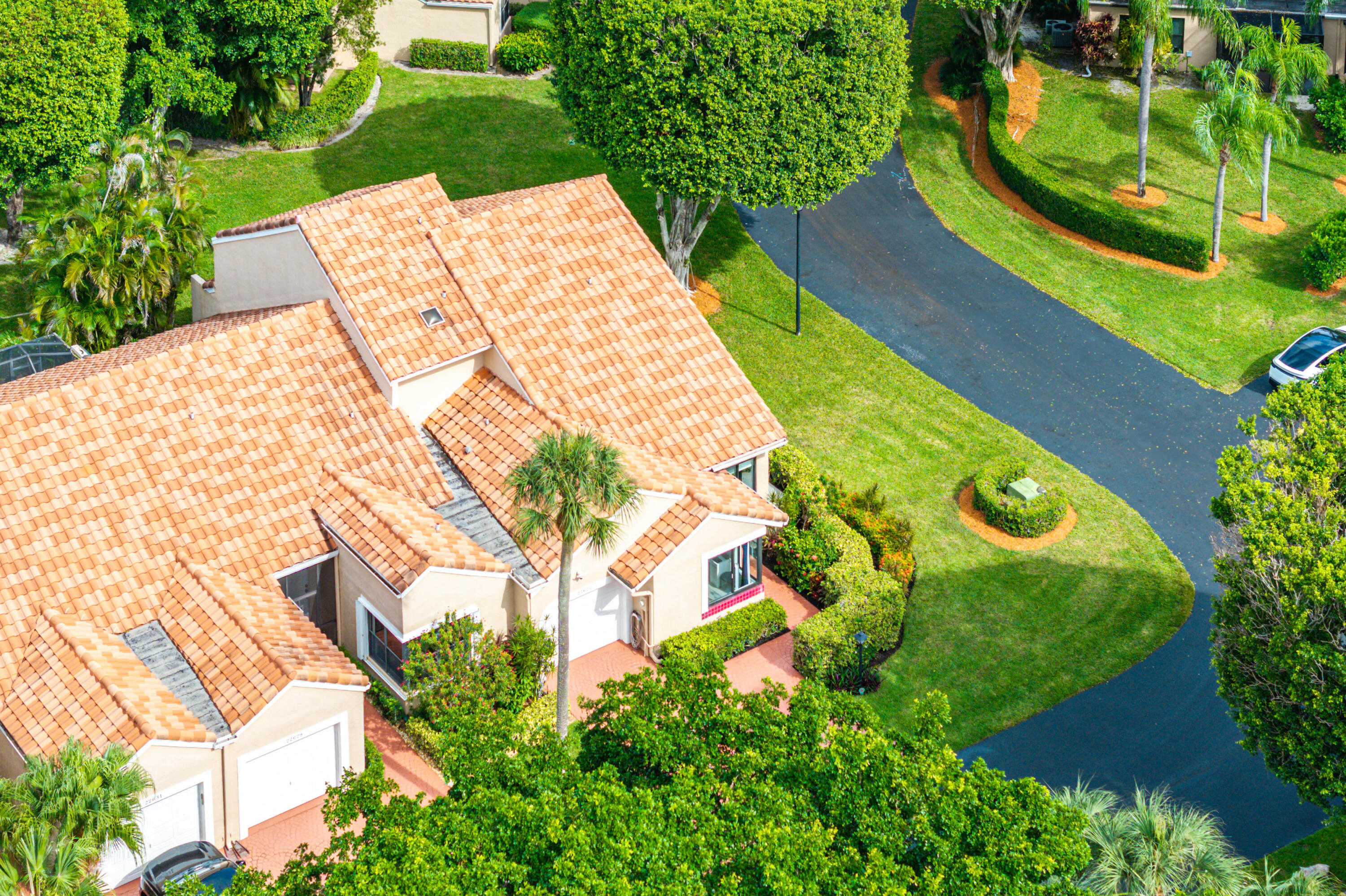 22627 Meridiana Drive Boca Raton, FL 33433 - Photo 49 of 58 a view of a swimming pool with a garden and plants