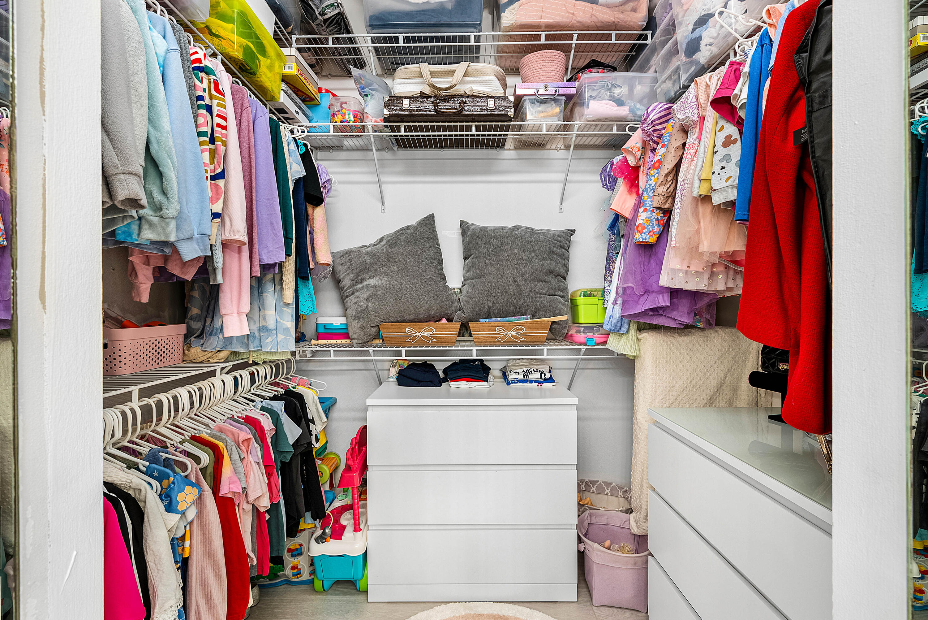 22627 Meridiana Drive Boca Raton, FL 33433 - Photo 56 of 58 a view of walk in closet with clothes and shoes