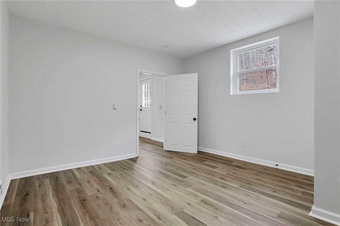 455 Back Run Road Philo, OH 43771 - Photo 32 of 44 Empty room featuring baseboards and wood finished floors